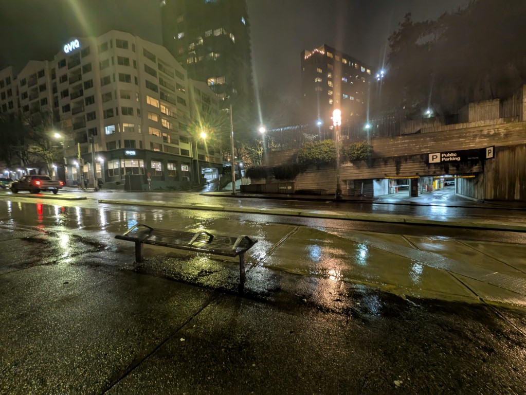 Avia and Arch parking garage at night